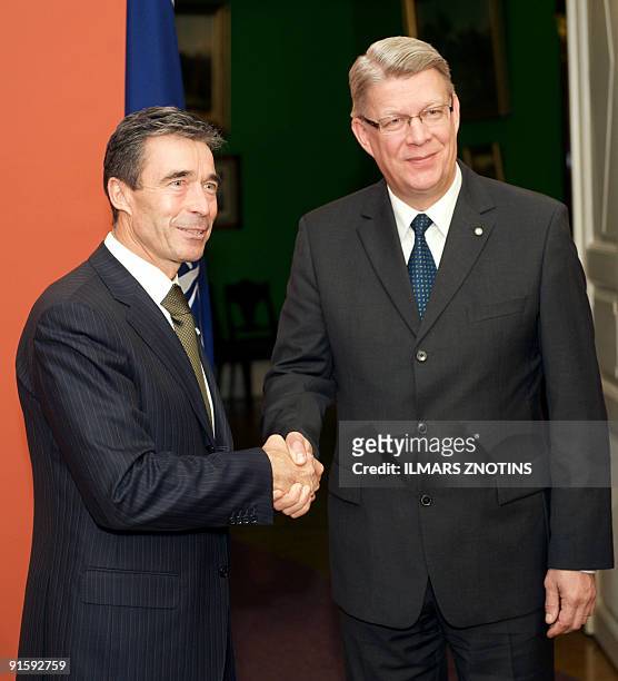 Secretary General Anders Fogh Rasmussen shakes hands with Latvian President Valdis Zatlers after a joint press conference on October 8, 2009 in Riga....