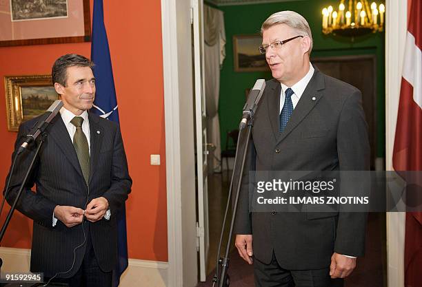 Secretary General Anders Fogh Rasmussen listens to Latvian President Valdis Zatlers during a joint press conference on October 8, 2009 in Riga. AFP...