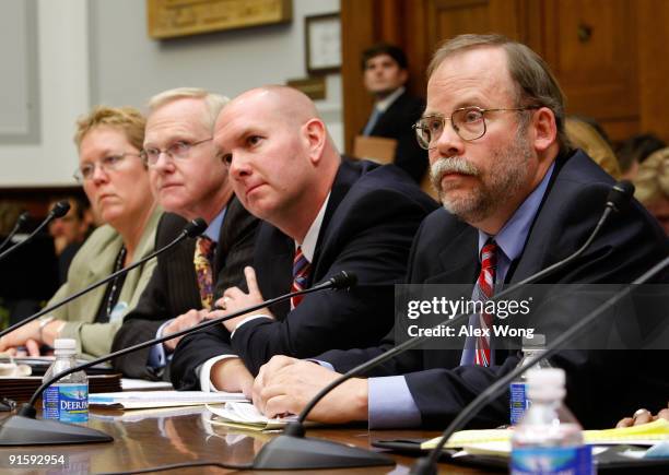 Kathy Miller, board member of the Vermont Grocers' Association; David Evans, lecturer at the University of Chicago Law School; Mark Caverly of the...