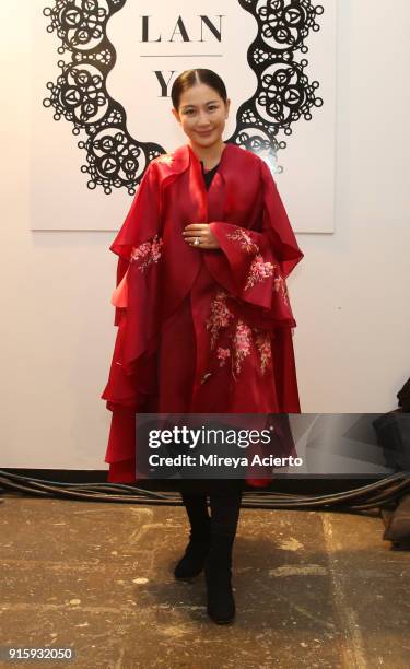 Designer Lan Yu poses backstage for Lanyu during New York Fashion Week: The Shows at Industria Studios on February 8, 2018 in New York City.