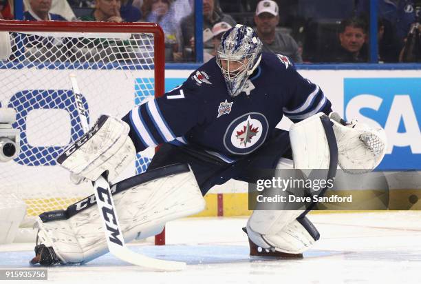 Goaltender Connor Hellebuyck of the Winnipeg Jets competes in the GEICO NHL Save Streak during 2018 GEICO NHL All-Star Skills Competition at Amalie...