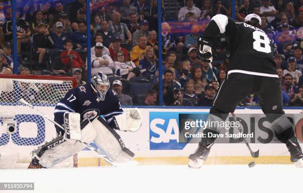 Goaltender Connor Hellebuyck of the Winnipeg Jets competes in the GEICO NHL Save Streak during 2018 GEICO NHL All-Star Skills Competition at Amalie...