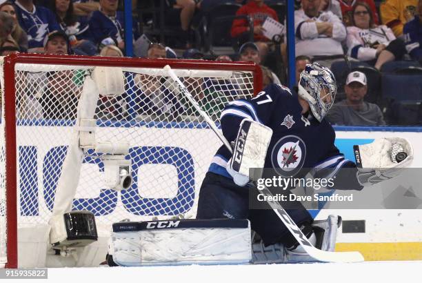 Goaltender Connor Hellebuyck of the Winnipeg Jets competes in the GEICO NHL Save Streak during 2018 GEICO NHL All-Star Skills Competition at Amalie...