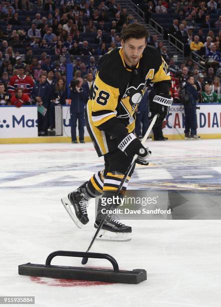 Kris Letang of the Pittsburgh Penguins competes in the Dunkin Donuts NHL Passing Challenge during 2018 GEICO NHL All-Star Skills Competition at...
