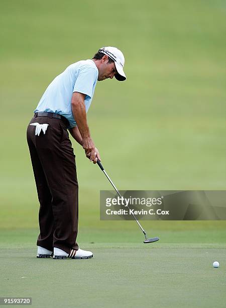 Mike Weir of Canada putts during the first round of THE TOUR Championship presented by Coca-Cola, the final event of the PGA TOUR Playoffs for the...