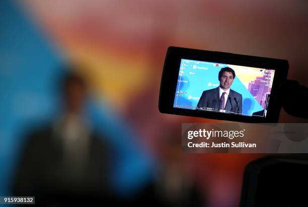 Canada Prime Minister Justin Trudeau is visible in a television camera monitor as he speaks to members of the media during a visit to AppDirect on...