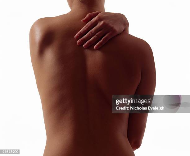 a woman's bare back - bare back stock-fotos und bilder