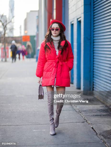 Mary Leest wearing red beret, turtleneck, red puffer jacket, overknees boots seen outside Creatures of Comfort on February 8, 2018 in New York City.