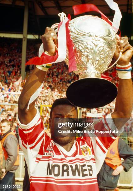 Martin Offiah of Wigan rugby league holds the trophy aloft after their 28-12 victory over Castleford in the Rugby League Challenge Cup Final at...