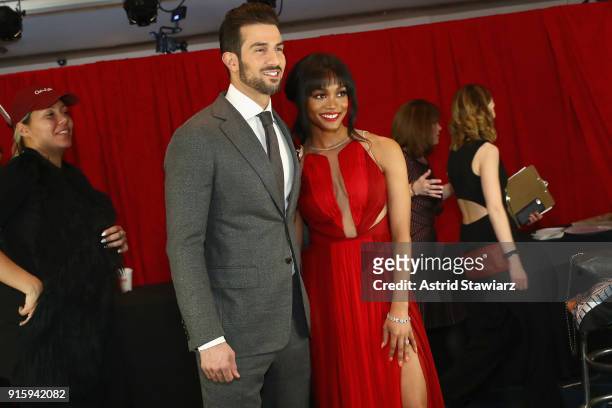 Personalities Bryan Abasolo and Rachel Lindsay pose backstage at the American Heart Association's Go Red For Women Red Dress Collection 2018...