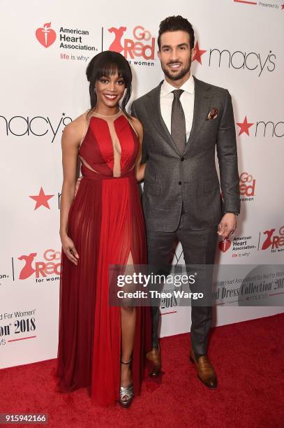 Personalities Rachel Lindsay and Bryan Abasolo pose backstage at the American Heart Association's Go Red For Women Red Dress Collection 2018...