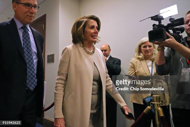 House Minority Leader Nancy Pelosi arrives for a House Democratic caucus meeting at the U.S. Capitol February 8, 2018 in Washington, DC. Support from...