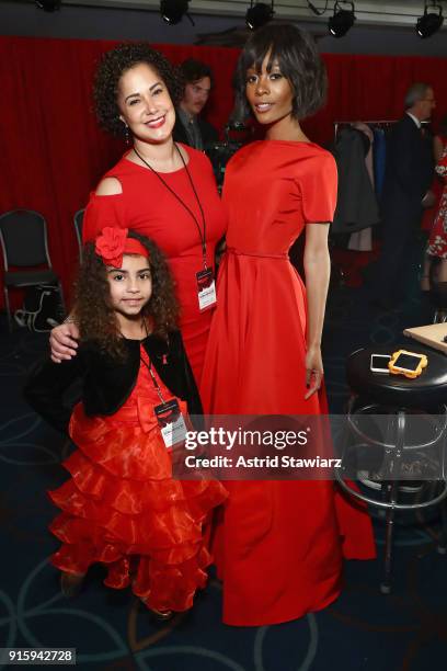 Milly Adams, Nicole Green and Zuri Hall pose backstage at the American Heart Association's Go Red For Women Red Dress Collection 2018 presented by...