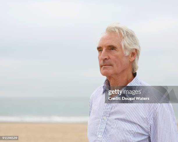 elderly man at beach. - 65 69 years stock pictures, royalty-free photos & images