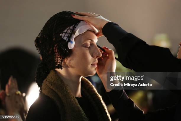 Model prepares backstage for Xuly.Bet x Mimi Prober x Hogan McLaughlin during New York Fashion Week: The Shows at Industria Studios on February 8,...