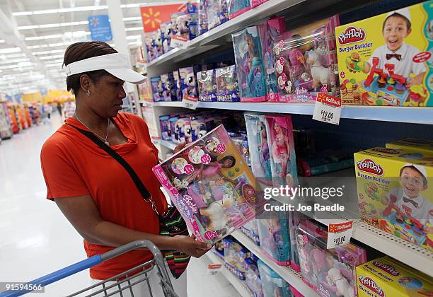 Tanya Johnson shops in the toy department of the Wal-Mart store on October 8, 2009 in Pompano Beach, Florida. Wal-Mart stores, Inc. Announced...