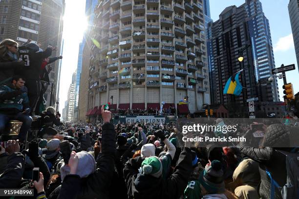 Fans celebrate with the Philadelphia Eagles during their NFL Super Bowl victory parade on February 8, 2018 in Philadelphia, Pennsylvania. The...