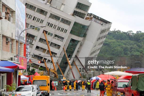Rescue operation continues while steel pillers are set to hold a leaning building on February 8, 2018 in Hualien, Taiwan. At least seven people were...