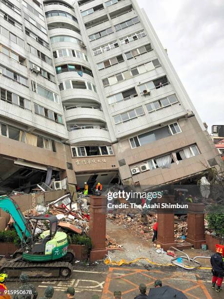 Rescue operation continues while steel pillers are set to hold a leaning building on February 8, 2018 in Hualien, Taiwan. At least seven people were...