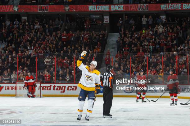 Kyle Turris of the Nashville Predators salutes the crowd as he is honoured a warm welcome back at Canadian Tire Centre during a game against the...