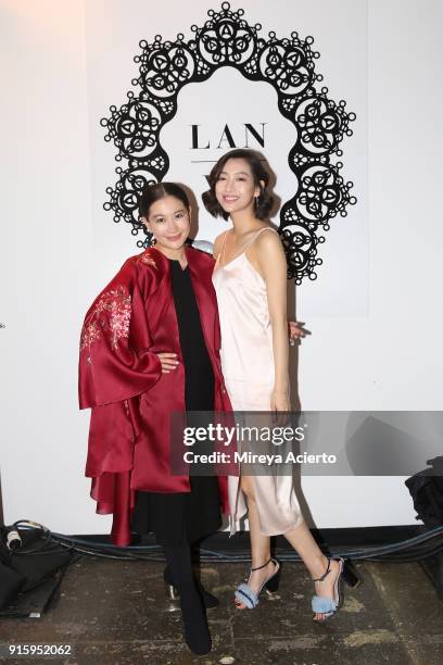 Designer Lan Yu and a model poses backstage for Lanyu during New York Fashion Week: The Shows at Industria Studios on February 8, 2018 in New York...