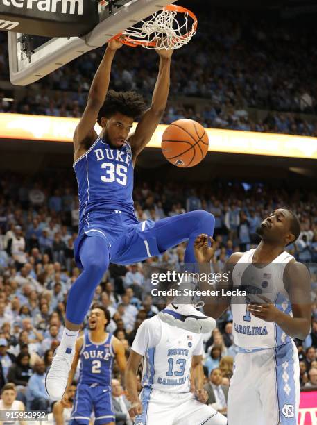 Theo Pinson of the North Carolina Tar Heels watches as Marvin Bagley III of the Duke Blue Devils dunks the ball during their game at Dean Smith...