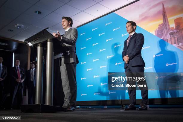 Justin Trudeau, Canada's prime minister, left, speaks during a press conference with Daniel Saks, president and co-chief executive officer of...