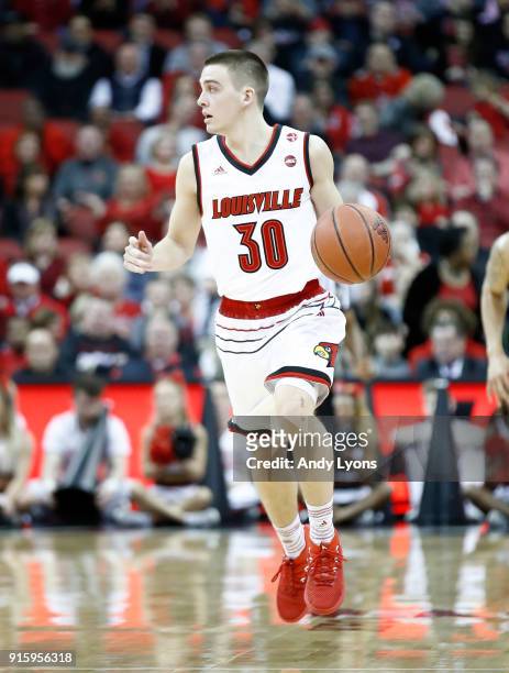 Ryan McMahon of the Louisville Cardinals dribbles the ball against the Georgia Tech Yellow Jackets during the game at KFC YUM! Center on February 8,...