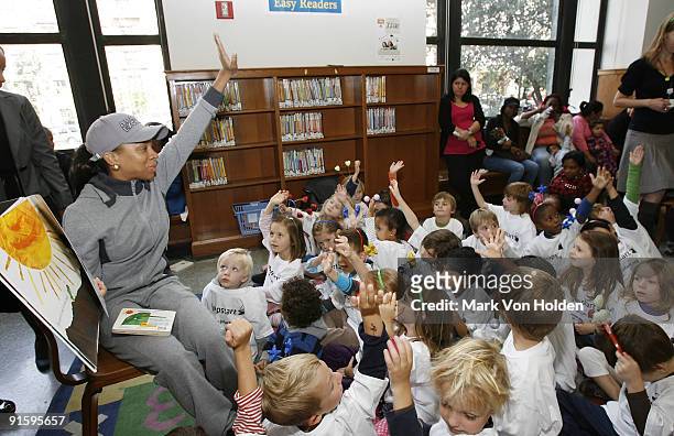 Lil' Mama reads to children at Jump Start's "Read for the Record" at Brooklyn Public Library's Central Library on October 8, 2009 in the Brooklyn...