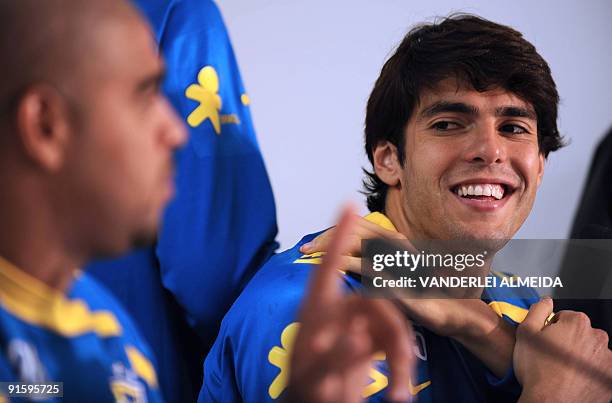 Brazilian national football team players Kaka and Adriano smile during a press conference before a training session October 8 in Teresopolis, Brazil....