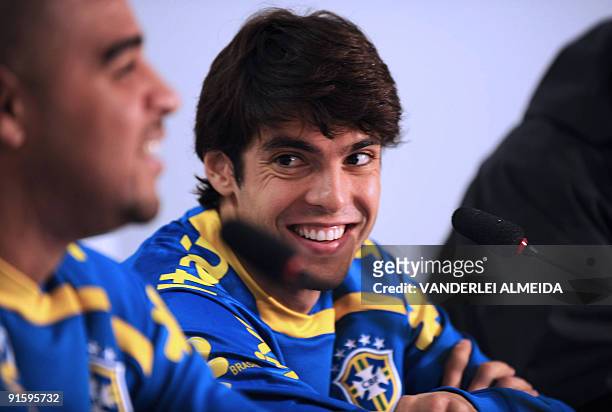 Brazilian national football team players Kaka and Adriano smile during a press conference before a training session October 8 in Teresopolis, Brazil....