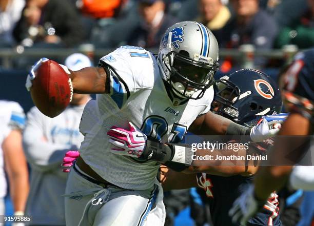 Calvin Johnson of the Detroit Lions breaks away from Kevin Payne of the Chicago Bears on October 4, 2009 at Soldier Field in Chicago, Illinois. The...