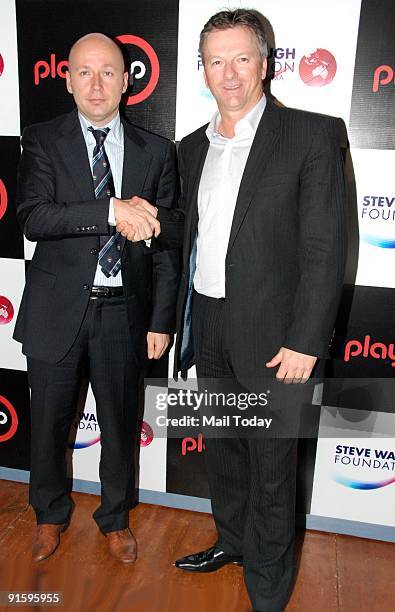 Former Australian captain Steve Waugh shakes hands with co-founder of iPlayup George Tomesk during the announcement of Delhi Daredevils vs Victoria...