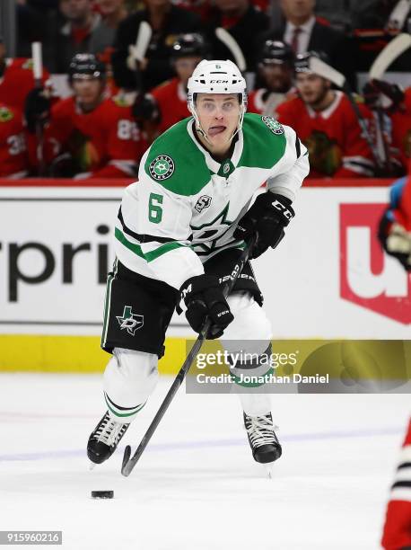 Julius Honka of the Dallas Stars advances the puck against the Chicago Blackhawks at the United Center on February 8 2018 in Chicago, Illinois.