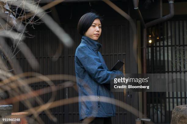 Mayuko Uemura, game designer of Hit-Point Co., poses for a photograph in Kyoto, Japan, on Monday, Jan. 29, 2018. Tabi Kaeru, or Travel Frog, became...