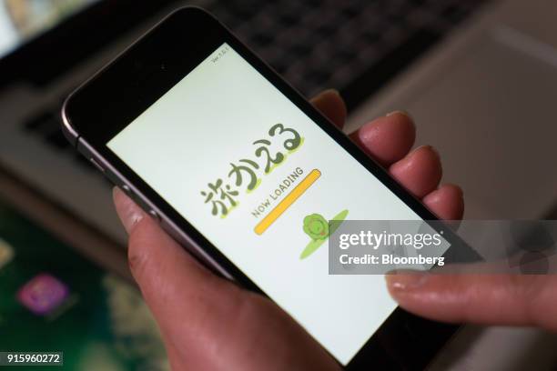 Hit-Point Co. Game app Tabi Kaeru, or Travel Frog, is arranged for a photograph on a smartphone in Tokyo, Japan, on Monday, Jan. 30, 2018. The game...