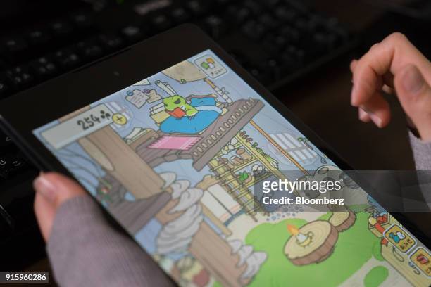 Hit-Point Co. Game app Tabi Kaeru, or Travel Frog, is arranged for a photograph on a tablet device in Kyoto, Japan, on Monday, Jan. 29, 2018. The...