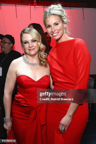 Actor Melissa Joan Hart and Model Niki Taylor prepares backstage at the American Heart Association's Go Red For Women Red Dress Collection 2018...