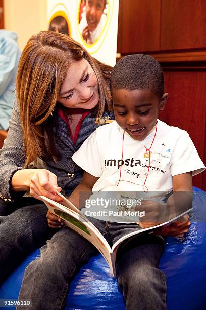 Rep. Loretta Sanchez reads to a child at Jump Start's "Read for the Record" at Capitol Hill on October 8, 2009 in Washington, DC.