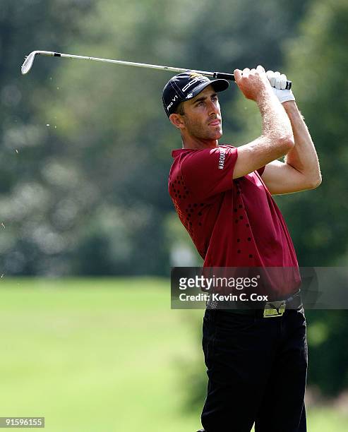 Geoff Ogilvy of Australia hits a shot during the first round of THE TOUR Championship presented by Coca-Cola, the final event of the PGA TOUR...