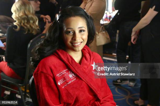 Karen A. Hill prepares backstage at the American Heart Association's Go Red For Women Red Dress Collection 2018 presented by Macy's at Hammerstein...