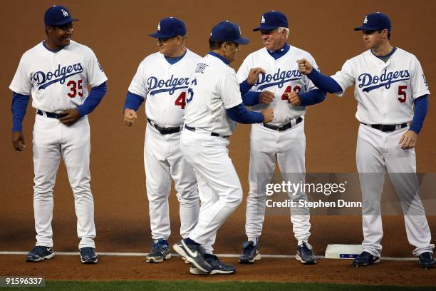 Manager Joe Torre of the Los Angeles Dodgers is announced during player introductions before taking on the St. Louis Cardinals in Game One of the...