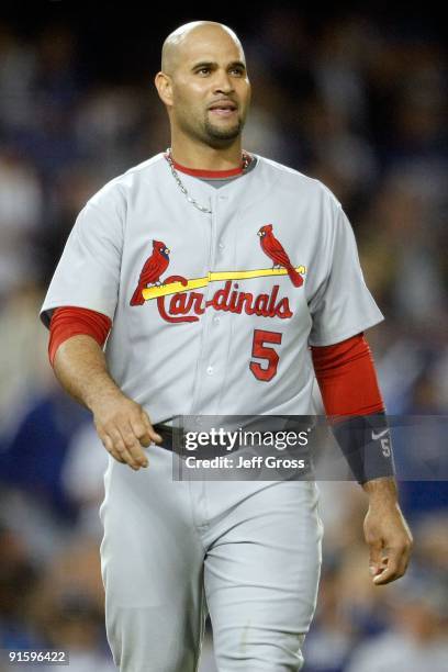 Albert Pujols of the St. Louis Cardinals reacts after the end of the top of the first inning against the Los Angeles Dodgers in Game One of the NLDS...