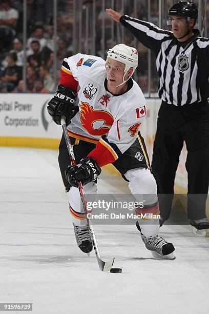 Jay Bouwmeester of the Calgary Flames skates with the puck against the Edmonton Oilers on September 23, 2009 at Rexall Place in Edmonton, Alberta,...