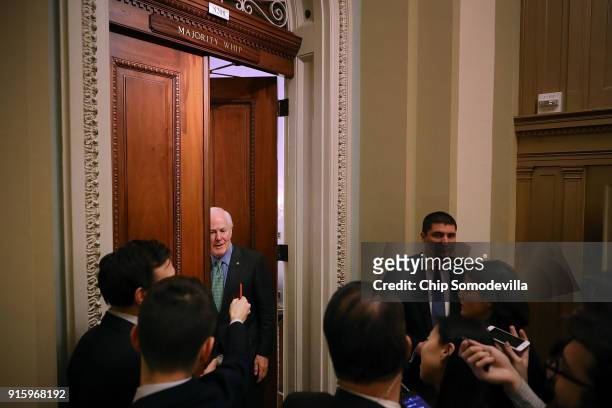Senate Majority Whip John Cornyn talks to reporters before heading into his office at the U.S. Capitol February 8, 2018 in Washington, DC. Cornyn...