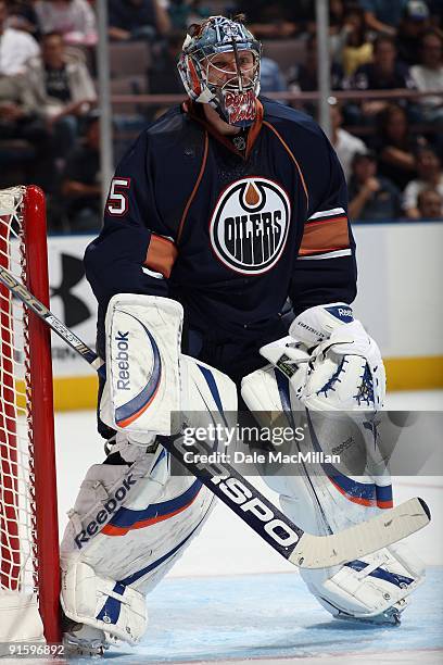 Nikolai Khabibulin of the Edmonton Oilers defends the net against the Calgary Flames on September 23, 2009 at Rexall Place in Edmonton, Alberta,...