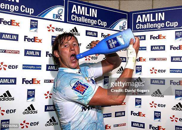Ollie Smith of Montpellier poses with the Amlin Man of the Match champagne after the Amlin Challenge Cup match between Worcester Warriors and...