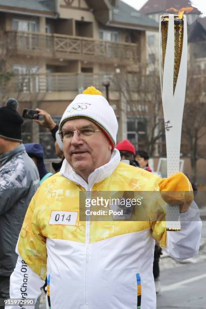 President of the International Olympic Committee Thomas Bach, takes part in the PyeongChang 2018 Torch Relay ahead of the start of the games on...