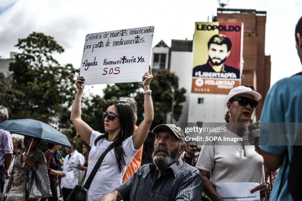 A female protester seen displaying a placard during the...