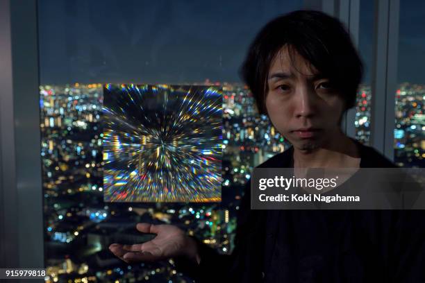 Yoichi Ochiai poses for a photographs at the Media Ambition Tokyo at Roppongi Hills on February 8, 2018 in Tokyo, Japan. The analog optical machine,...